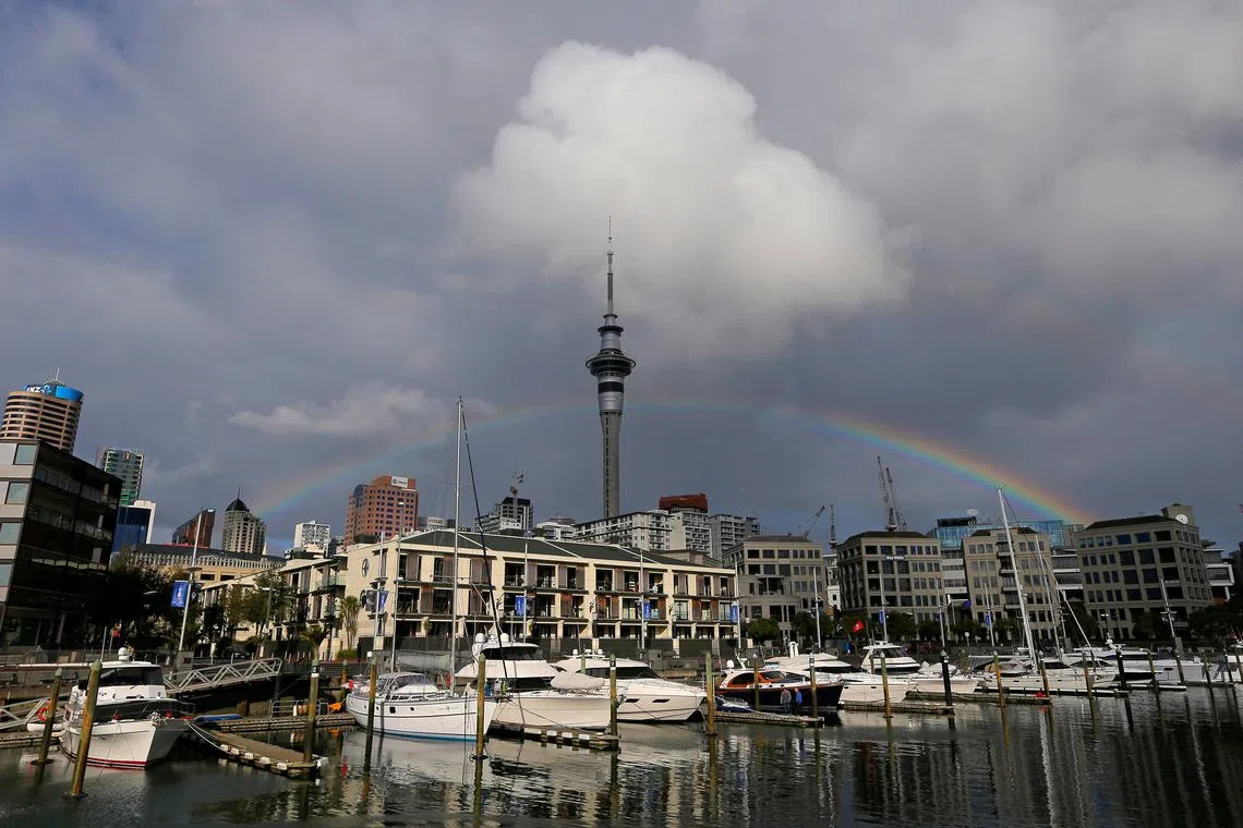 FILE PHOTO: A rainbow appears on the Auckland skyline featuring Sky Tower in New Zealand, July 8, 2017.  REUTERS/Jason Reed/File Photo