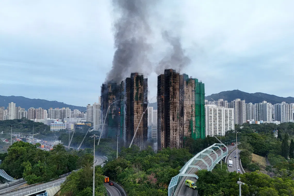 A drone view shows flames and thick smoke rising from the Wang Fuk Court housing estate in Hong Kong on Nov 27.