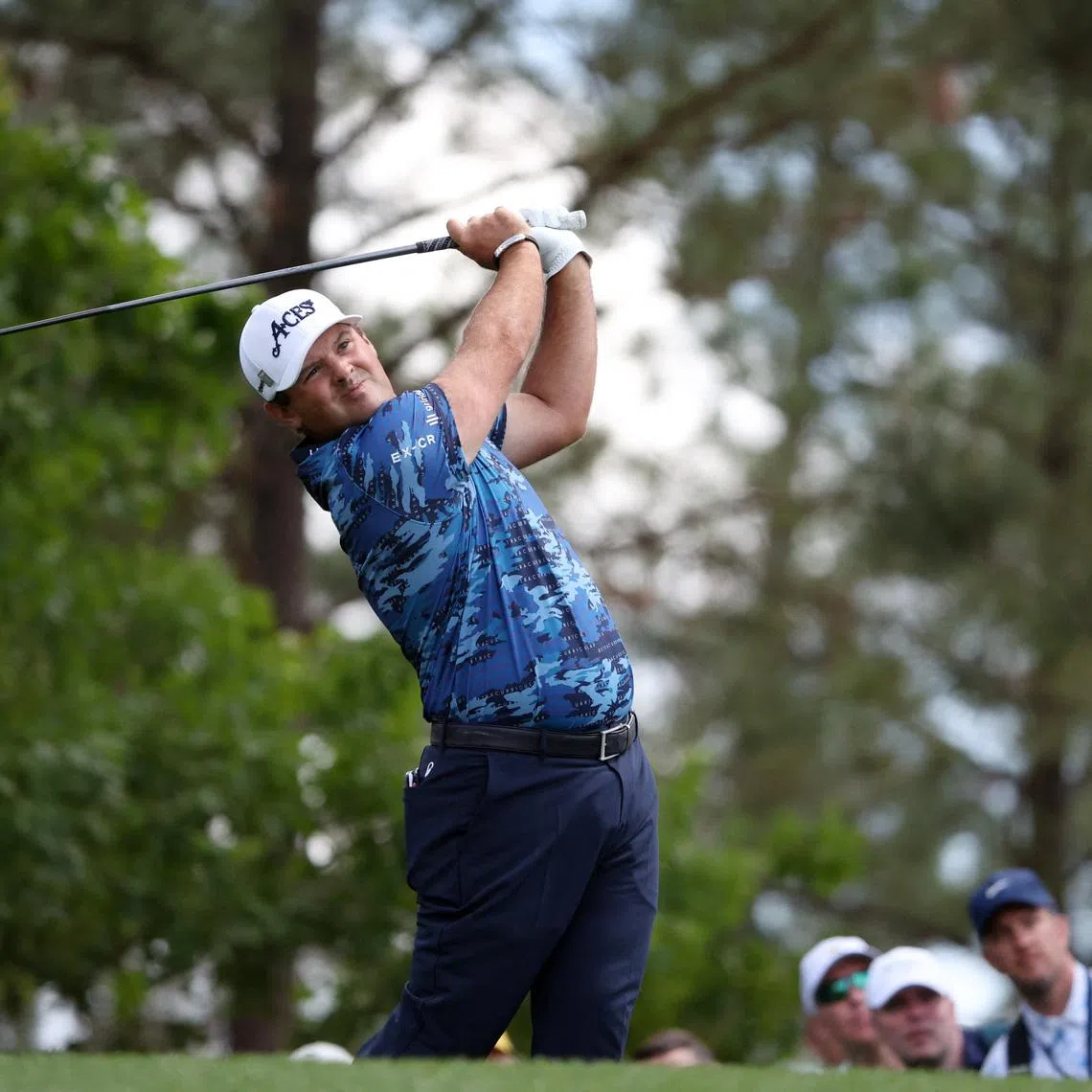 Golf - The Masters - Augusta National Golf Club, Augusta, Georgia, U.S. - April 11, 2025 Patrick Reed of the U.S. hits his tee shot on the 4th hole during the second round REUTERS/Pilar Olivares