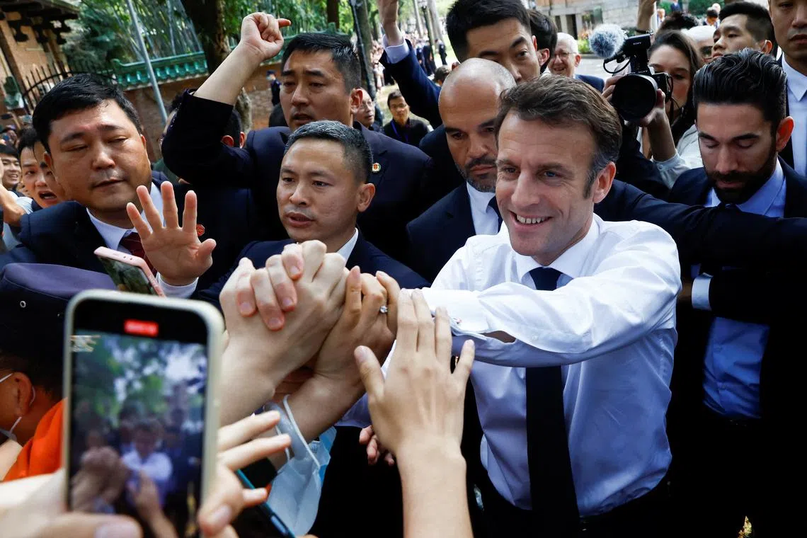 French President Emmanuel Macron arrives to attend a visit at Sun Yat-sen University in Guangzhou, China, April 7, 2023. REUTERS/Gonzalo Fuentes/Pool

