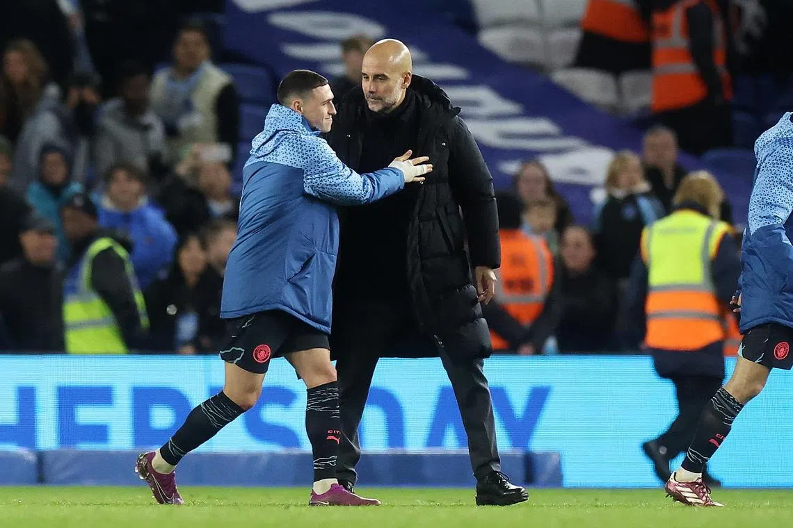 Manchester City forward Phil Foden and manager Pep Guardiola following the 4-0 English Premier League win over Brighton & Hove Albion.