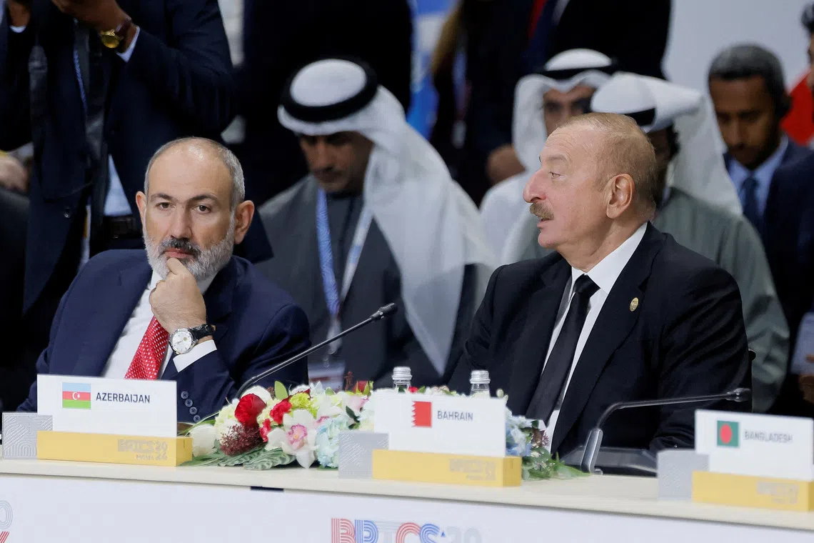 FILE PHOTO: Azerbaijan's President Ilham Aliyev and Armenia's Prime Minister Nikol Pashinyan attend a plenary session in the outreach/BRICS Plus format at the BRICS summit in Kazan, Russia October 24, 2024. REUTERS/Maxim Shemetov/Pool/File Photo