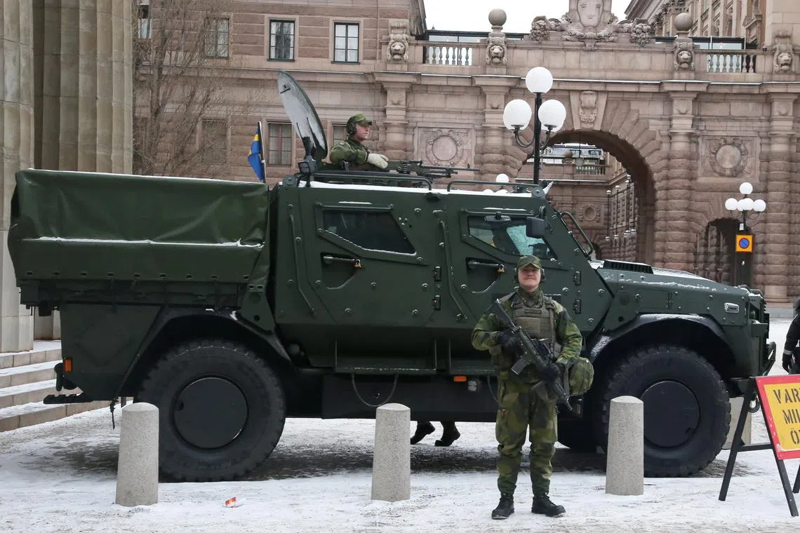 FILE PHOTO: Swedish soldiers wait outside the parliament buildings as they take part in an exercise in Stockholm, Sweden, February 17, 2025. REUTERS/ Tom Little/ File Photo
