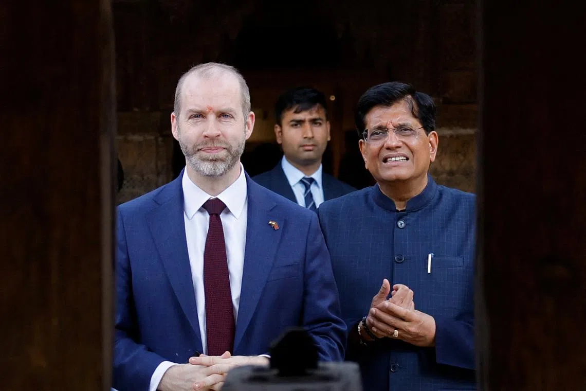 FILE PHOTO: Indian Minister of Commerce and Industry Piyush Goyal and a British delegation headed by Britain's Secretary of State for Business and Trade Jonathan Reynolds visit the National Crafts Museum and Hastkala Academy in New Delhi, India, February 24, 2025. REUTERS/Anushree Fadnavis/File Photo