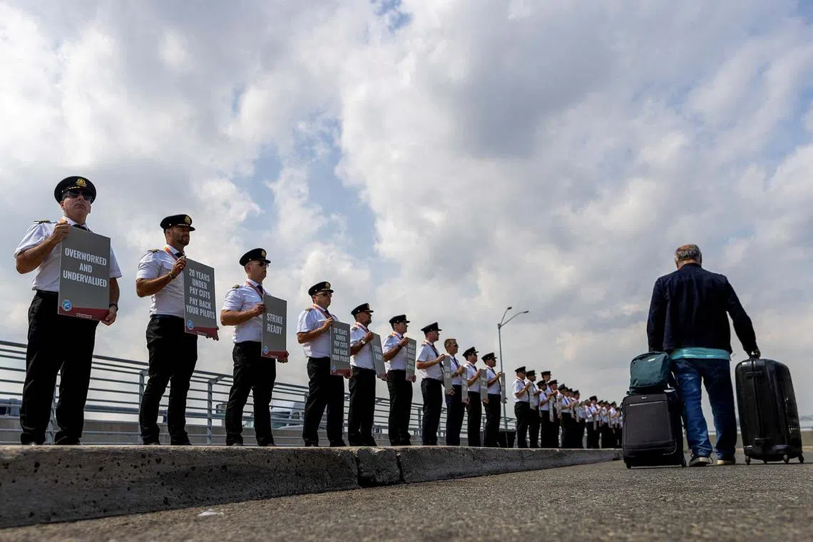 Air Canada pilots represented by the Air Line Pilots Association, Int’l (ALPA), who voted to authorize a strike, hold an informational picket at Toronto Pearson International Airport in Mississauga, Ontario, Canada August 27, 2024. REUTERS/Carlos Osorio TPX IMAGES OF THE DAY
