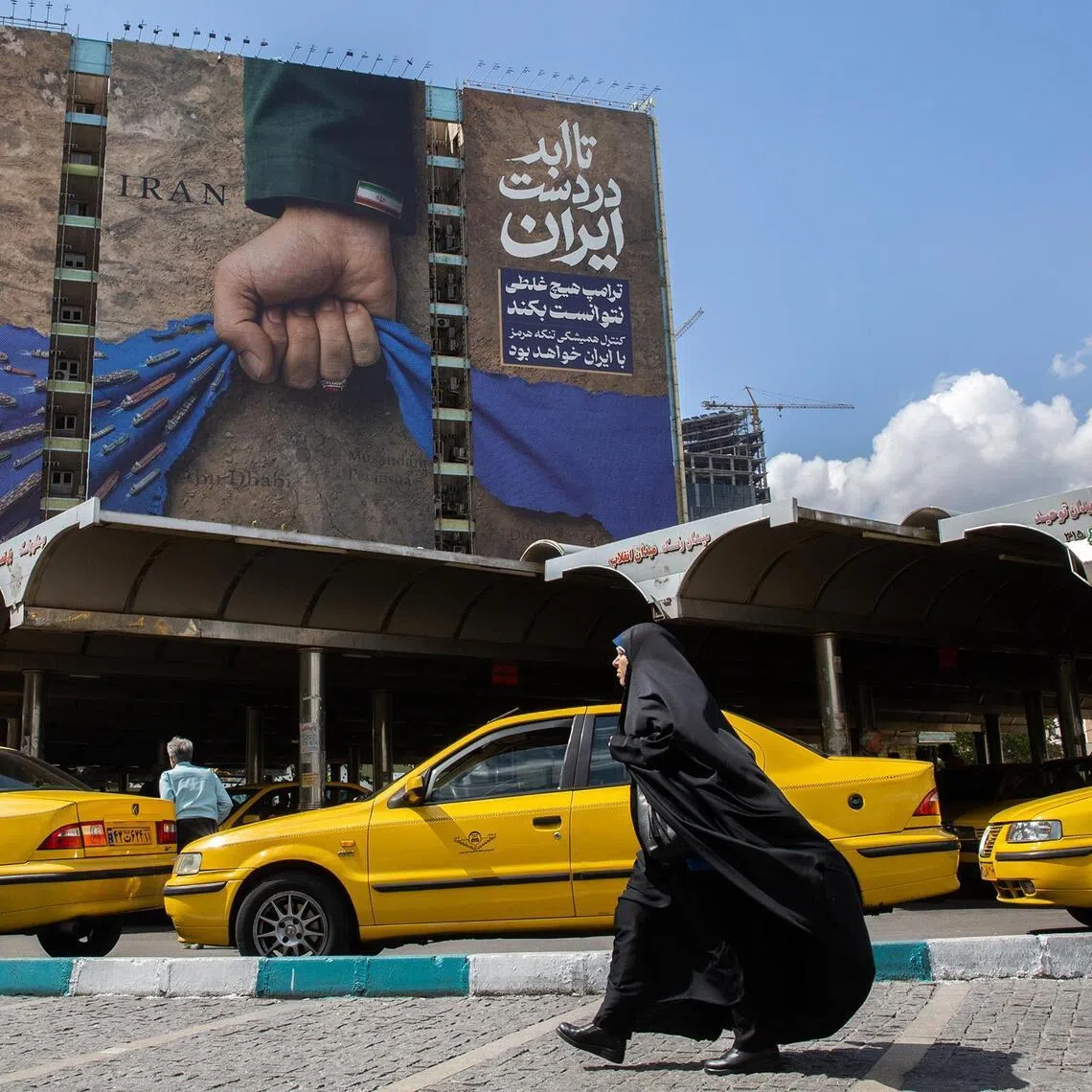 FILE — A mural showing Iran controlling the Strait of Hormuz in Tehran, Iran, on April 21, 2026. With President Trump’s visit to Beijing looming, China is pushing Iran to negotiate even as its companies export material that could be used by Iran’s military. (Arash Khamooshi/The New York Times) 