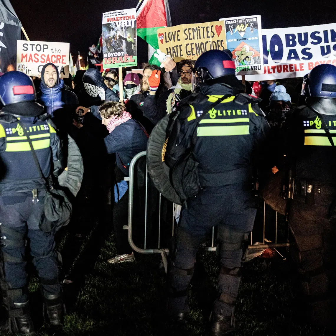 Police and protesters face off outside the Royal Concertgebouw concert hall in Amsterdam on Dec 14.