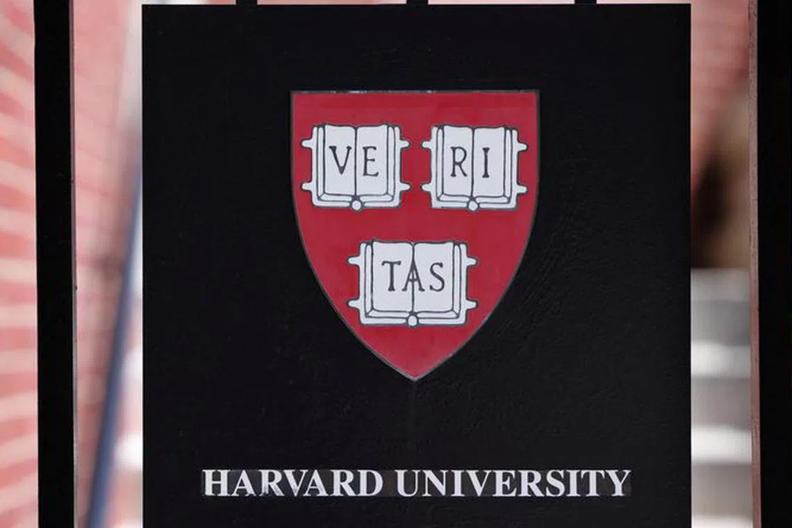 A sign hangs on a gate of a building at Harvard University in Cambridge, Massachusetts, U.S., July 6, 2023. REUTERS/Brian Snyder