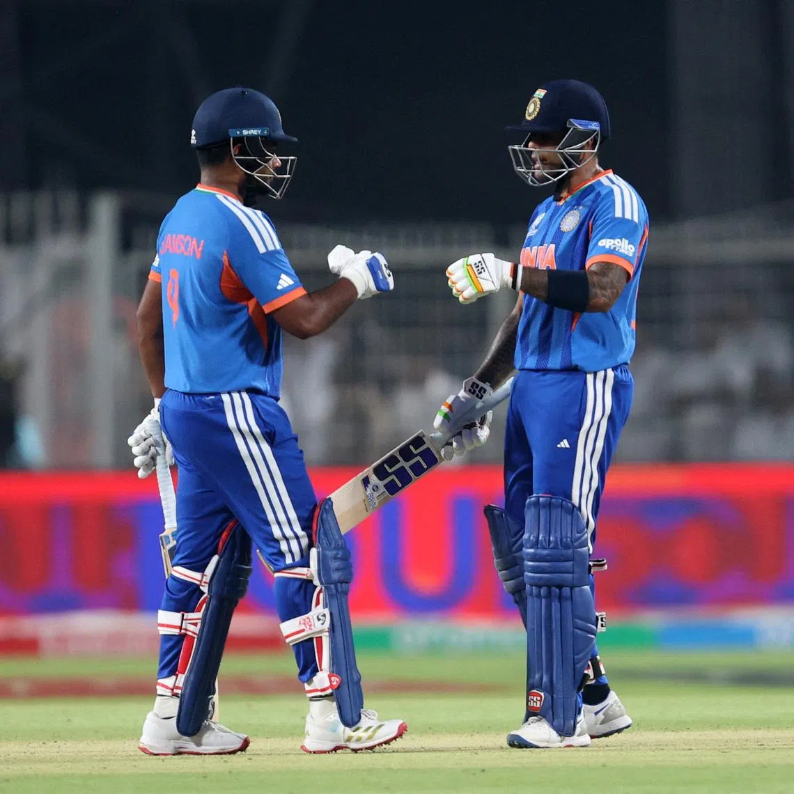 Cricket - ICC Men's T20 World Cup 2026 - Super 8 - India v West Indies - Eden Gardens, Kolkata, India - March 1, 2026 India's Suryakumar Yadav and Sanju Samson talk between overs. REUTERS/Sahiba Chawdhary
