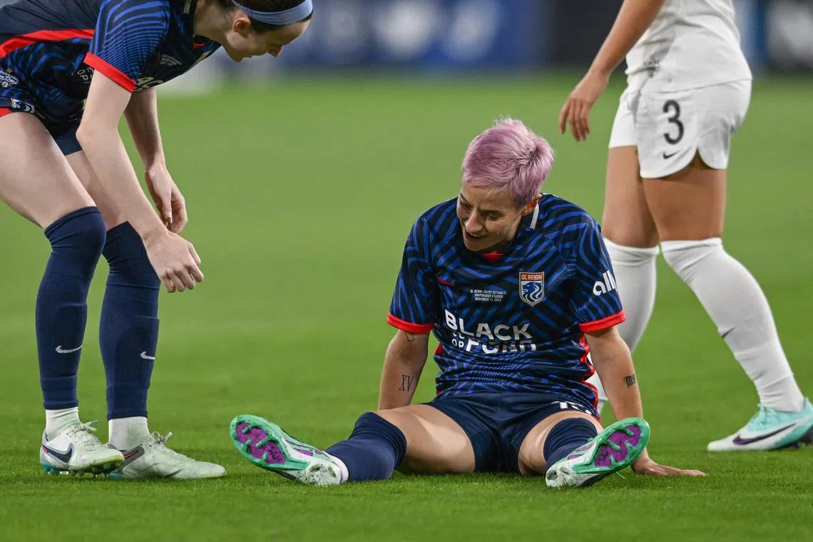 OL Reign's Megan Rapinoe on the pitch after an injury in the early minutes of the National Women's Soccer League final between OL Reign and Gotham FC at Snapdragon Stadium in San Diego.