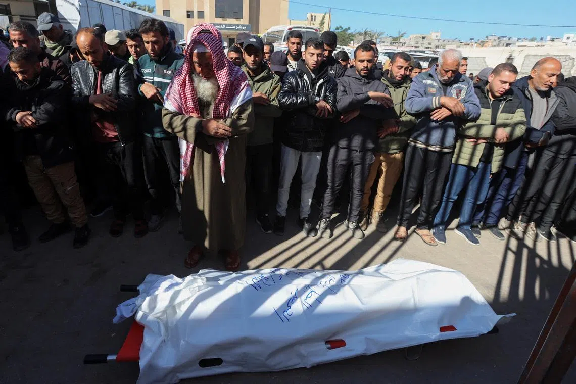 Mourners perform funeral prayers for senior Hamas police officer Mahmoud Al-Astal, who was killed on Monday, at Nasser Hospital in Khan Younis, southern Gaza Strip, January 12, 2026. REUTERS/Ramadan Abed