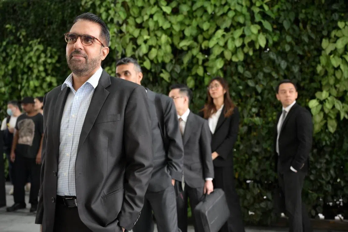 WP chief Pritam Singh queueing at the State Courts ahead his hearing on Nov 6.