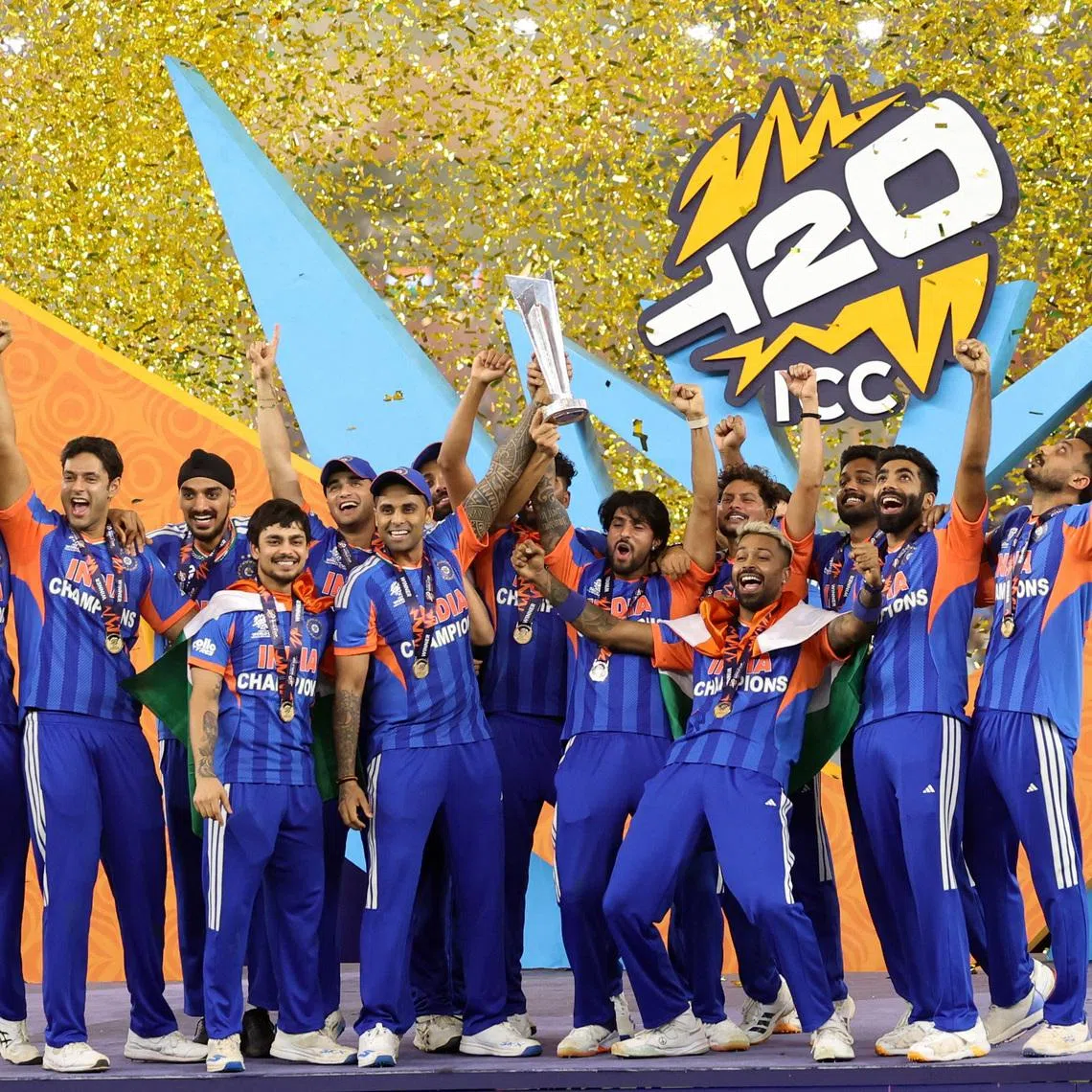 Cricket - ICC Men's T20 World Cup 2026 - Final - India v New Zealand - Narendra Modi Stadium, Ahmedabad, India - March 8, 2026 India's Suryakumar Yadav lifts the trophy as he celebrates with teammates after winning the ICC Men's T20 World Cup REUTERS/Amit Dave