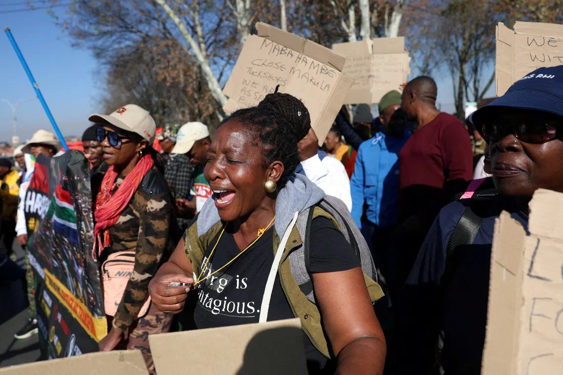 FILE PHOTO: Anti-immigrant protesters march after an unofficial June 30 deadline set by anti-immigrant groups for undocumented migrants to leave the country had passed, in Soweto, Johannesburg, South Africa, July 9, 2026. REUTERS/Oupa Nkosi/File Photo