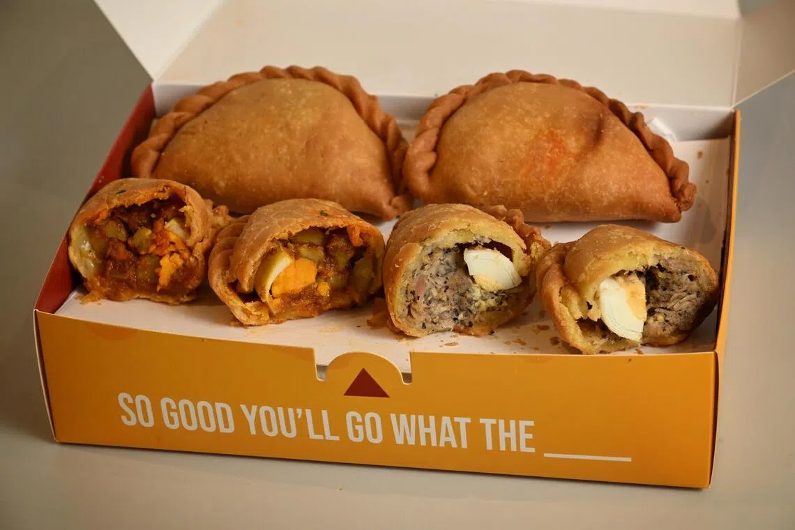 (From left) Cheesy Curry Puff and Black Pepper Chicken Puff.