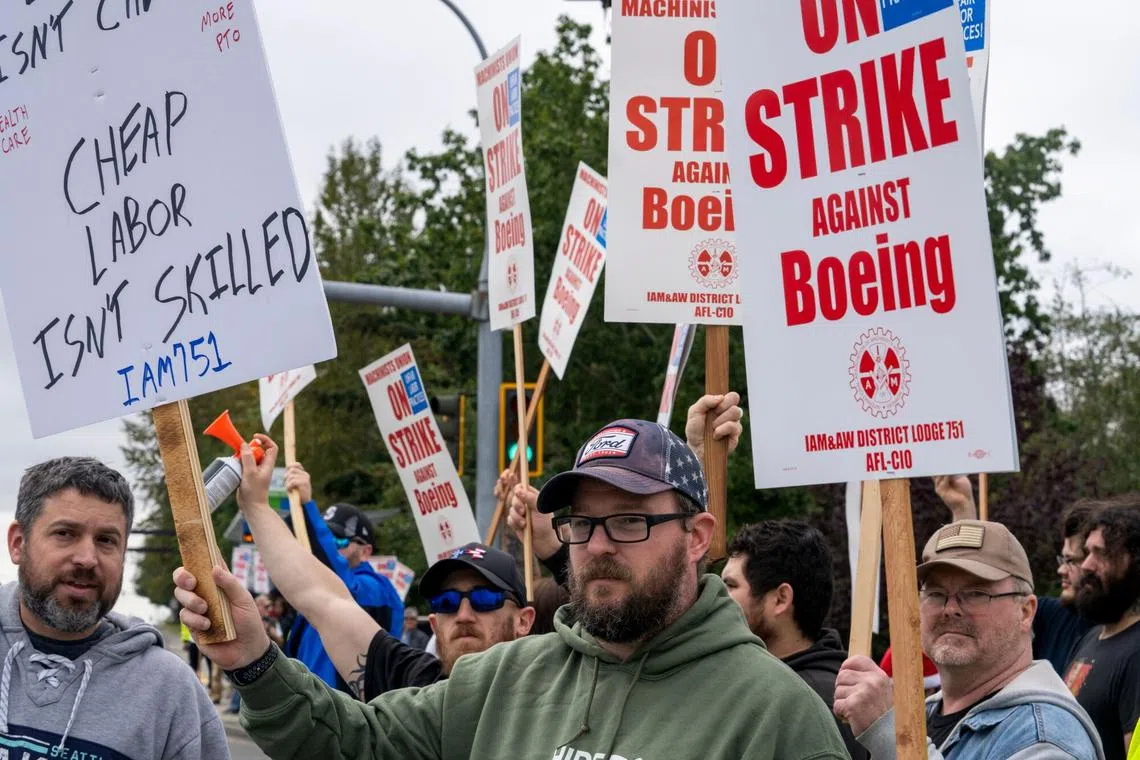 Workers outside the Boeing Co. manufacturing facility during a strike in Everett, Washington, on Sept 13, 2024.