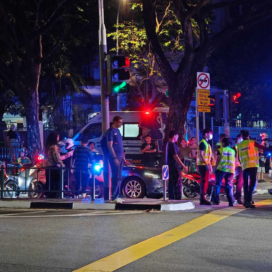When The Straits Times arrived at the scene, there were two ambulances. A stretcher meanwhile was carrying a casualty.