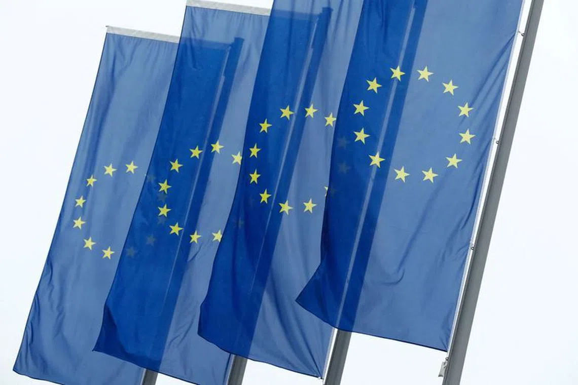 FILE PHOTO: European Union (EU) flags fly in front of the headquarters of the European Central Bank (ECB) in Frankfurt, Germany, July 8, 2020. REUTERS/Ralph Orlowski/File Photo