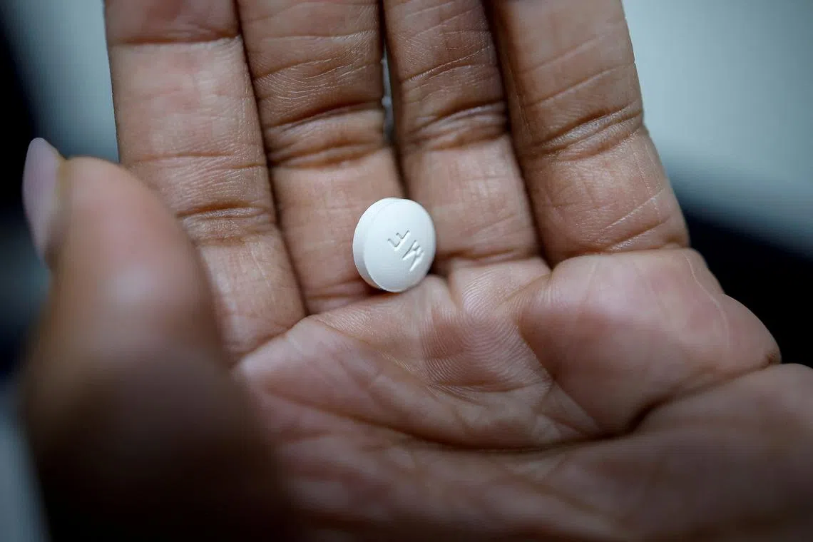 FILE PHOTO: A patient prepares to take Mifepristone, the first medication in a medical abortion, at Alamo Women's Clinic in Carbondale, Illinois, U.S., April 20, 2023. REUTERS/Evelyn Hockstein/File Photo