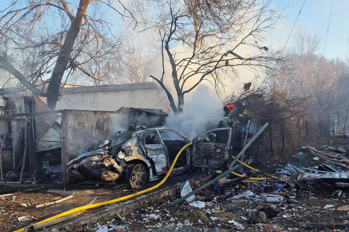 Firefighters work at a site of a Russian missile strike, amid Russia's attack on Ukraine, in Kharkiv, Ukraine March 7, 2025. REUTERS/Vyacheslav Madiyevskyy