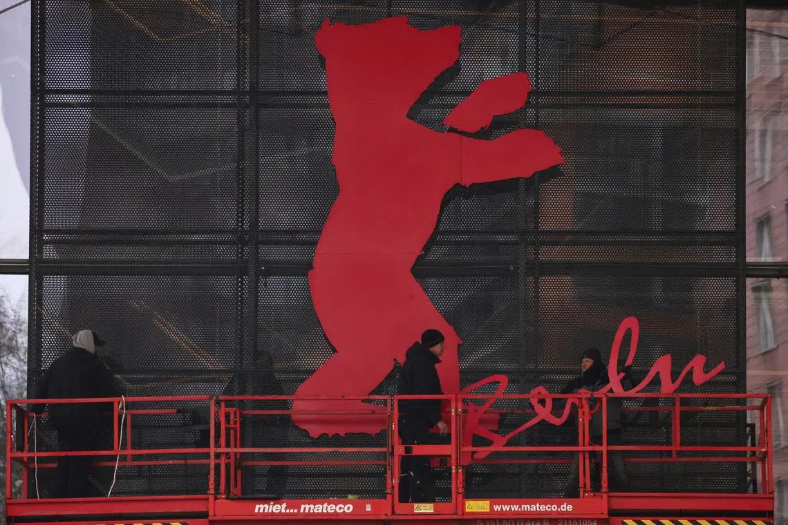 Workers mount the bear logo at the venue entrance of the \"Berlinale Palast\" for the upcoming Berlinale International Film Festival in Berlin, Germany, February 6, 2026. REUTERS/Liesa Johannssen