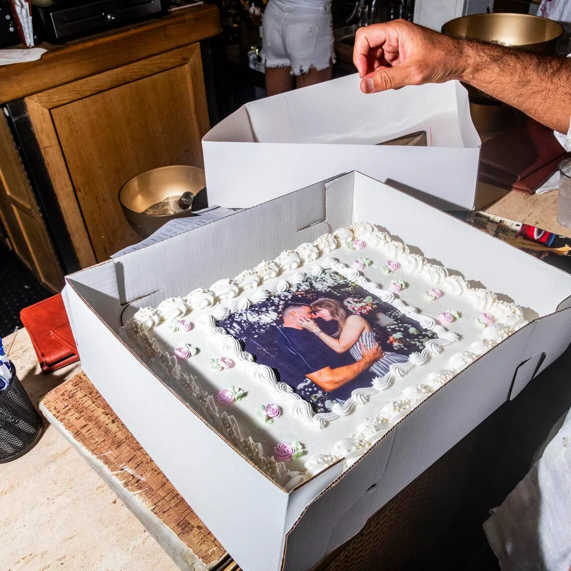 A sheet cake with an image of pop star Taylor Swift and football player Travis Kelce to celebrate their wedding, at a restaurant and bar in New York on July 3.