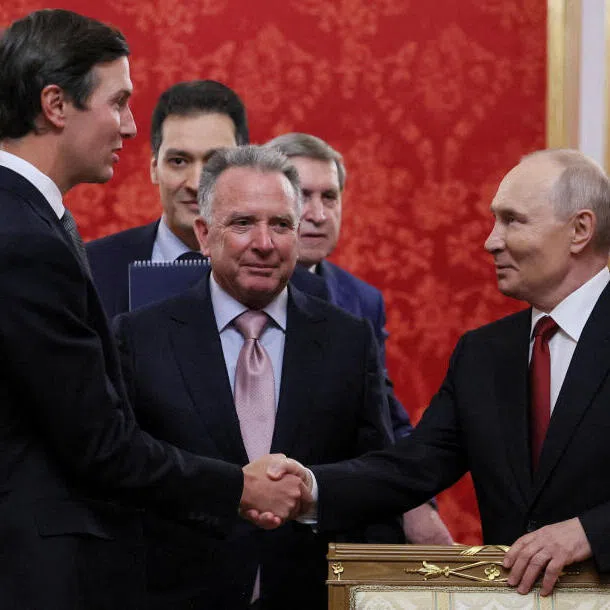 Jared Kushner, US President Donald Trump’s son-in-law (left), shakes hands with Russian President Vladimir Putin (right) during a meeting at the Kremlin in Moscow, Russia on Sept 5.