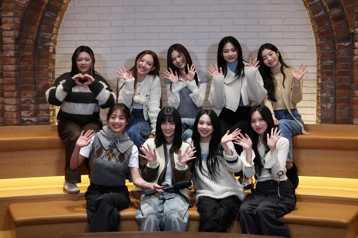 Members of the K-pop girl group TWICE pose for photographs during an interview with Reuters in Seoul, South Korea, January 29, 2024.   REUTERS/Kim Hong-Ji