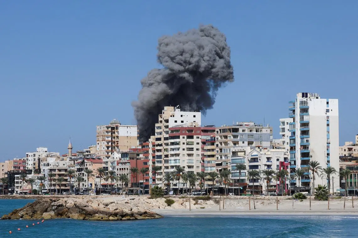Smoke billows over the UNESCO-listed port city of Tyre after Israeli strikes, amid the ongoing hostilities between Hezbollah and Israeli forces, southern Lebanon October 23, 2024. REUTERS/Aziz Taher