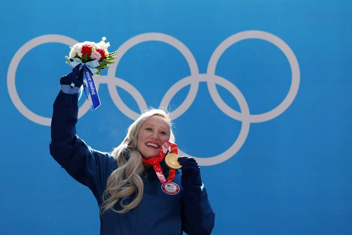 FILE PHOTO: 2022 Beijing Olympics - Victory Ceremony - Bobsleigh - Women's Monobob - National Sliding Centre, Beijing, China - February 14, 2022. Kaillie Humphries of the United States celebrates on the podium with her gold medal. REUTERS/Edgar Su/File Photo