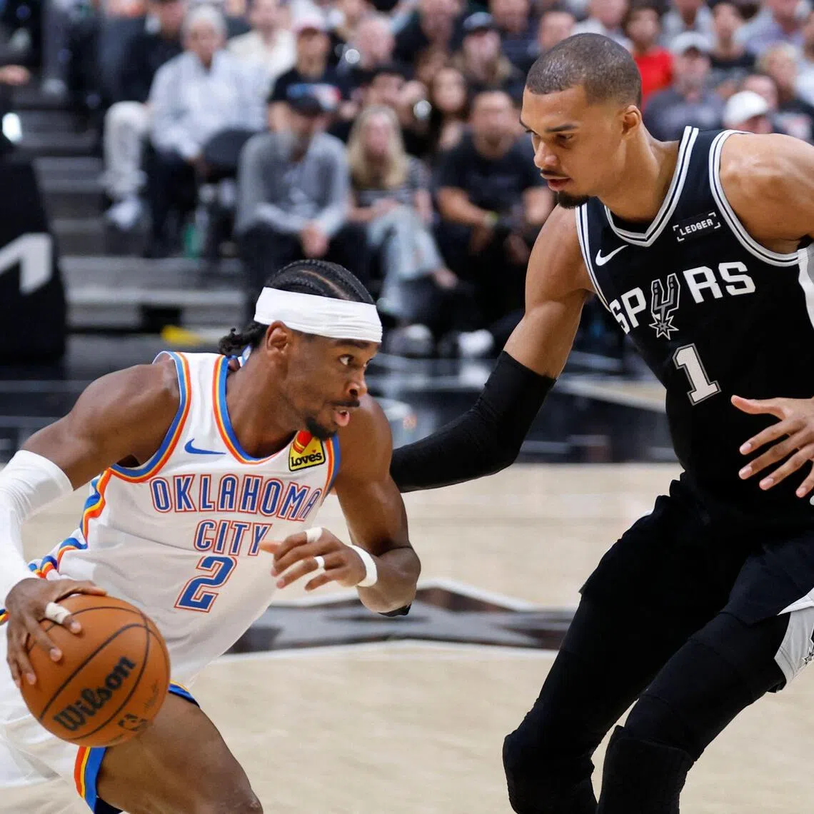 Shai Gilgeous-Alexander of the Oklahoma City Thunder drives against Victor Wembanyama of the San Antonio Spurs in the second half of Game 6.