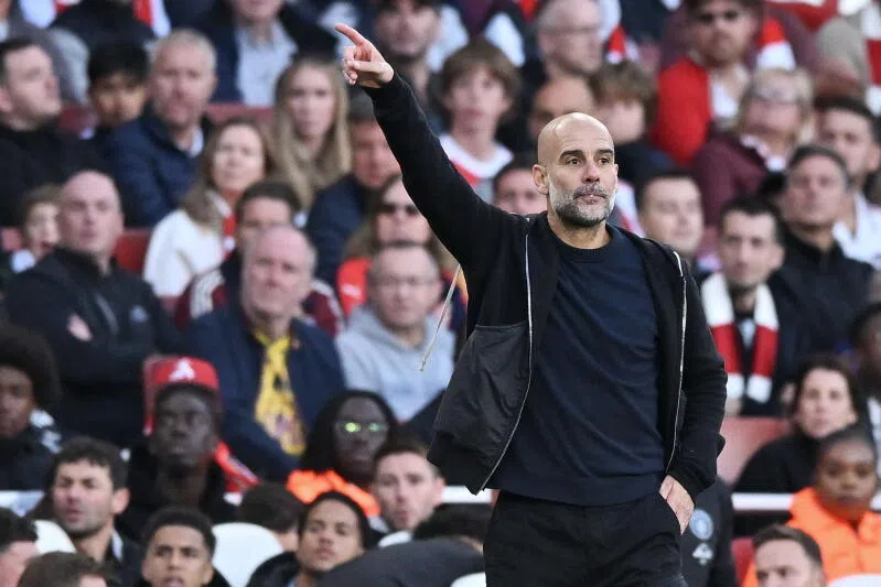 Manchester City's head coach Pep Guardiola gestures during the EPL match between Arsenal and Manchester City.