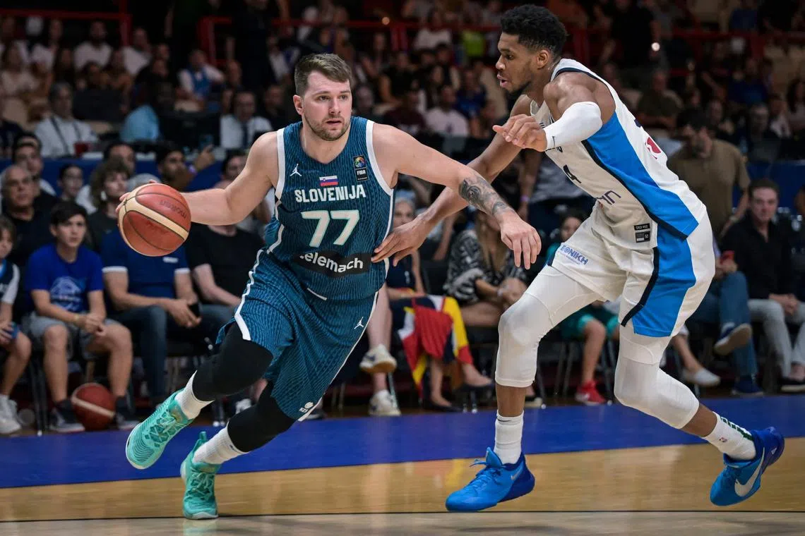Slovenia’s Luka Doncic (left) being guarded by Greece’s Giannis Antentokoumpo during the 2024 Fiba Olympic Qualifying Tournament semi-final basketball match between Greece and Slovenia at the Peace and Friendship Stadium in Athens on July 6. Greece won 96-68.