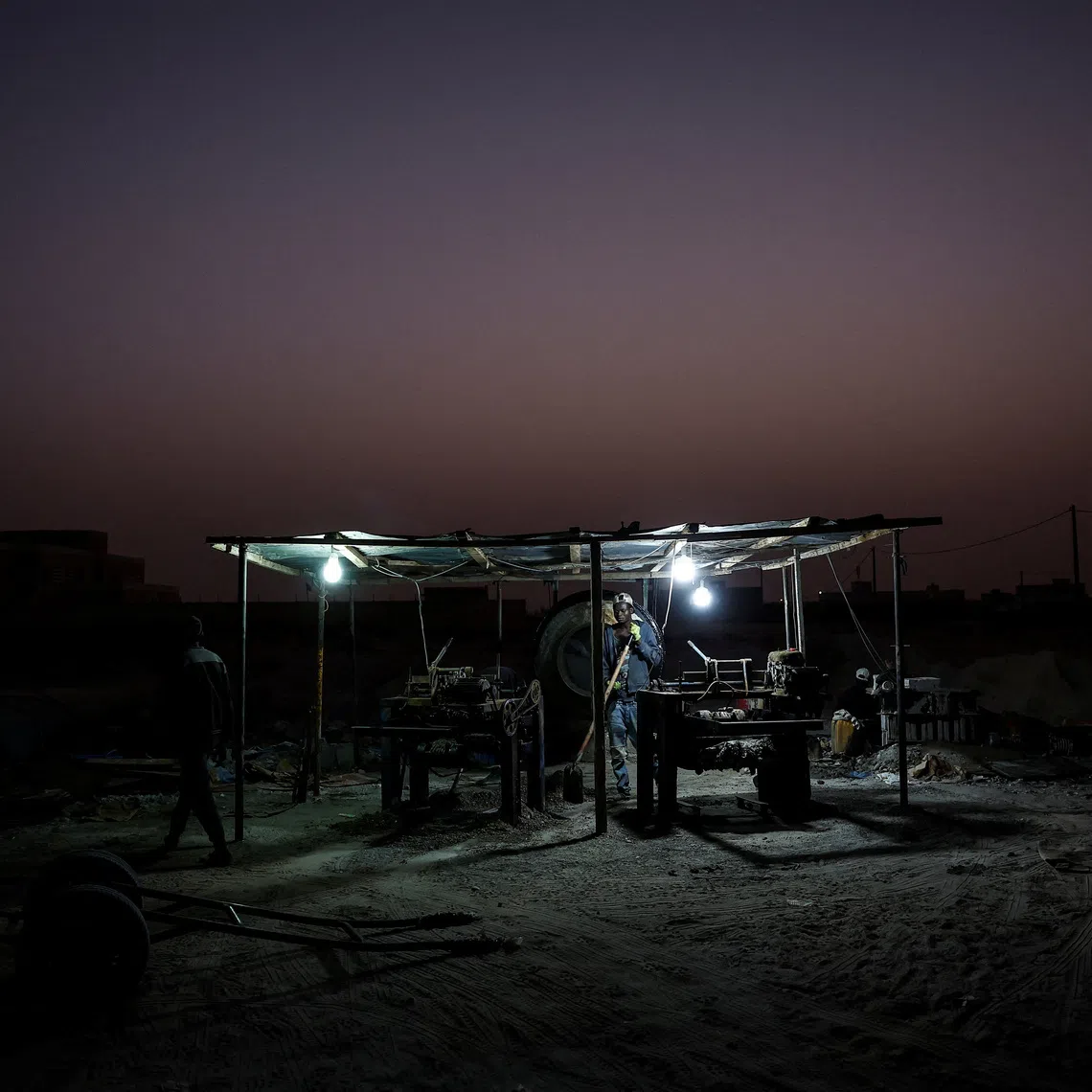 Maka Keila, 27, and Garry Ndajy, 32, work at an open-air brick workshop, on the outskirts of Nouakchott, Mauritania, February 22, 2025, amid a crackdown on irregular migration following a 2024 partnership agreement with the European Union. \"I know a lot of people who go to Nouadibou (a northern port in Mauritania),\" Keila said. \"There are a lot of friends there, who were looking to get to Europe. They say that now everything has stopped.\"  REUTERS/Juan Medina