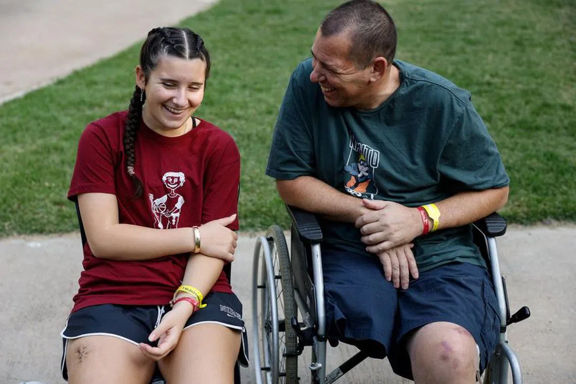 Hadar Bachar (13) from Kibbutz Beeri, talks to her father Avida, at Sheba Medical Centre where they are recovering from there injuries sustained during the deadly October 7 Hamas attack on the kibbutz, that claimed the lives of her mother and brother, in Ramat Gan, Israel November 13, 2023 REUTERS/Amir Cohen