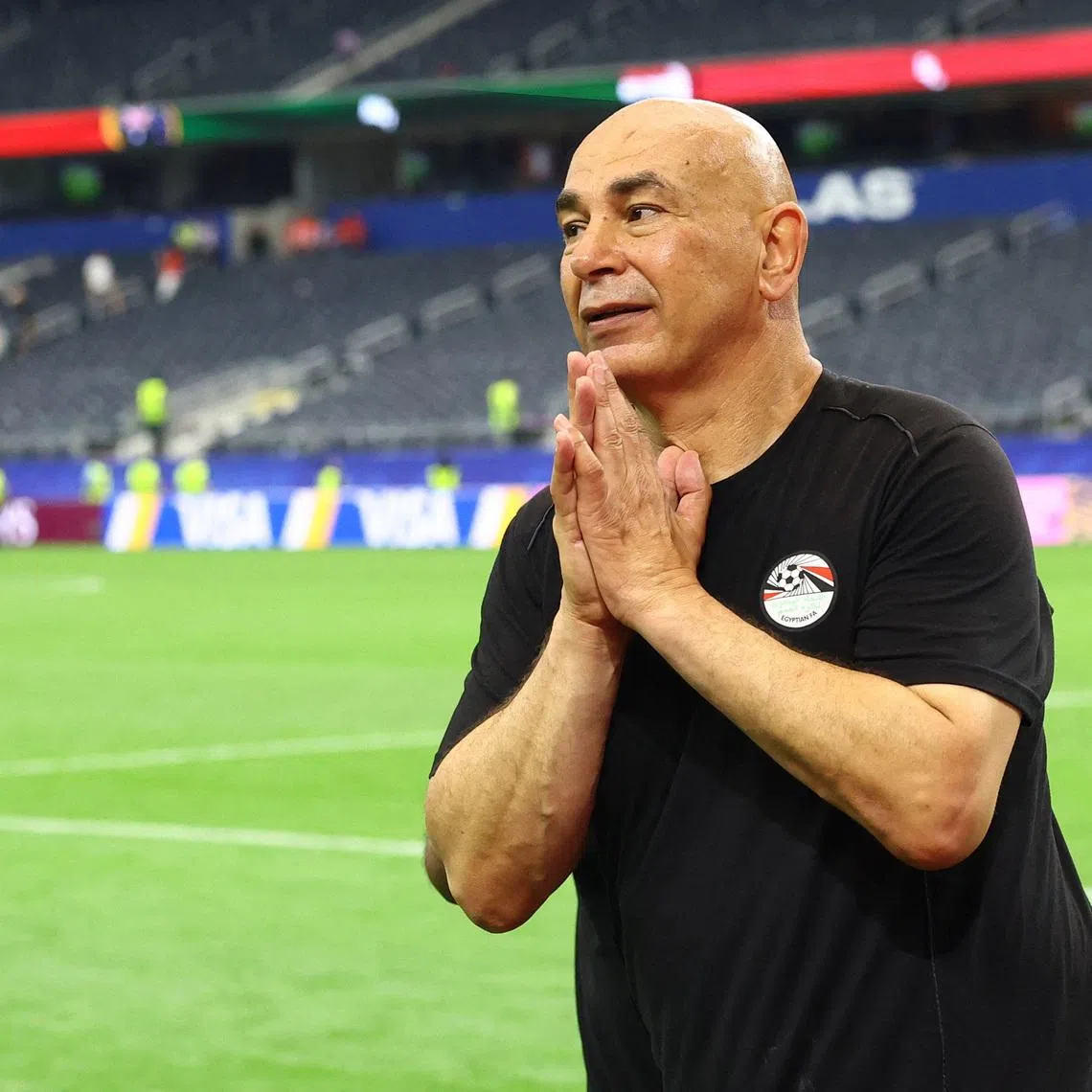 Soccer Football - FIFA World Cup 2026 - Round of 32 - Australia v Egypt - Dallas Stadium, Arlington, Texas, U.S. - July 3, 2026 Egypt coach Hossam Hassan celebrates after the match as Egypt qualify for the Round of 16 stage of the World Cup REUTERS/Hannah Mckay