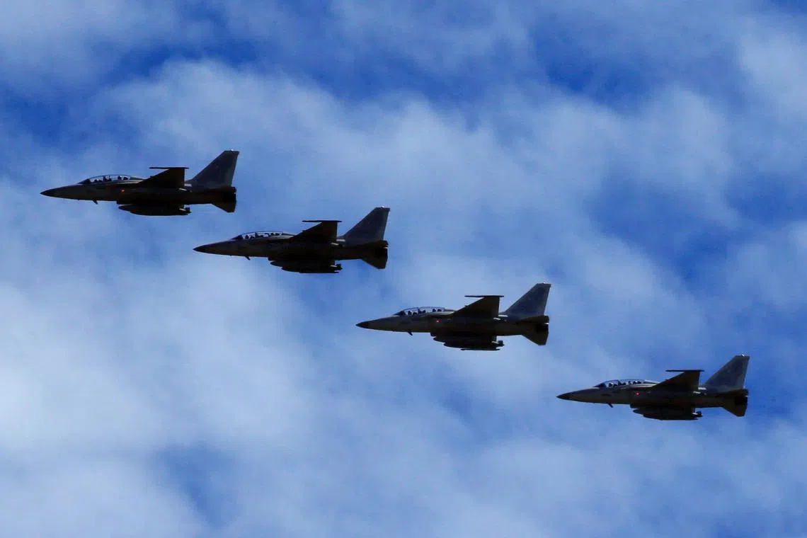 FILE PHOTO: FA-50 fighter jets, newly purchased from South Korea, are escorted by fighter jets in the sky upon arrival in Clark air base, Angeles city, Pampanga province, north of Manila, Philippines December 1, 2016.  REUTERS/Romeo Ranoco/File Photo