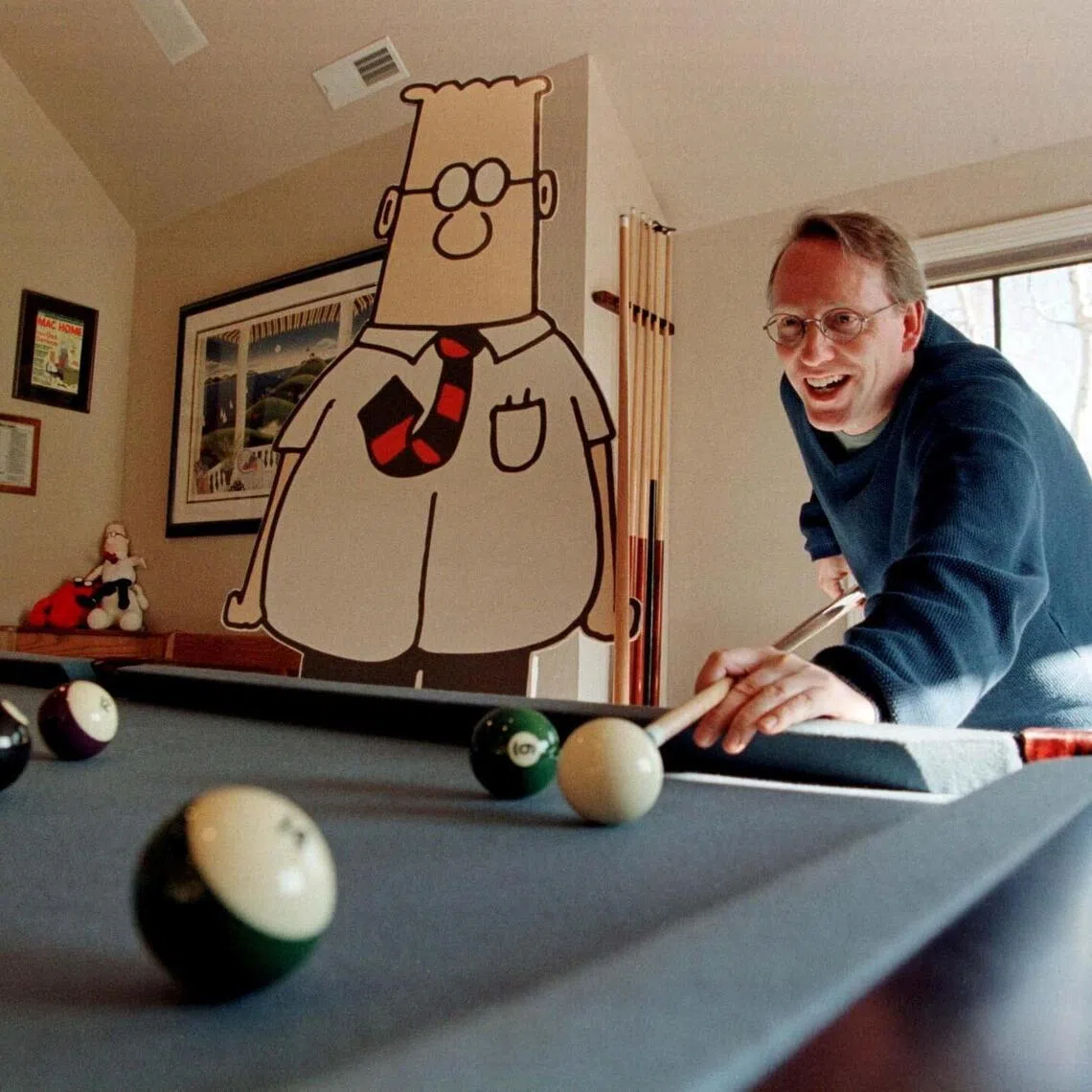 Scott Adams (right) with his comic book creation Dilbert at his home in California, US.