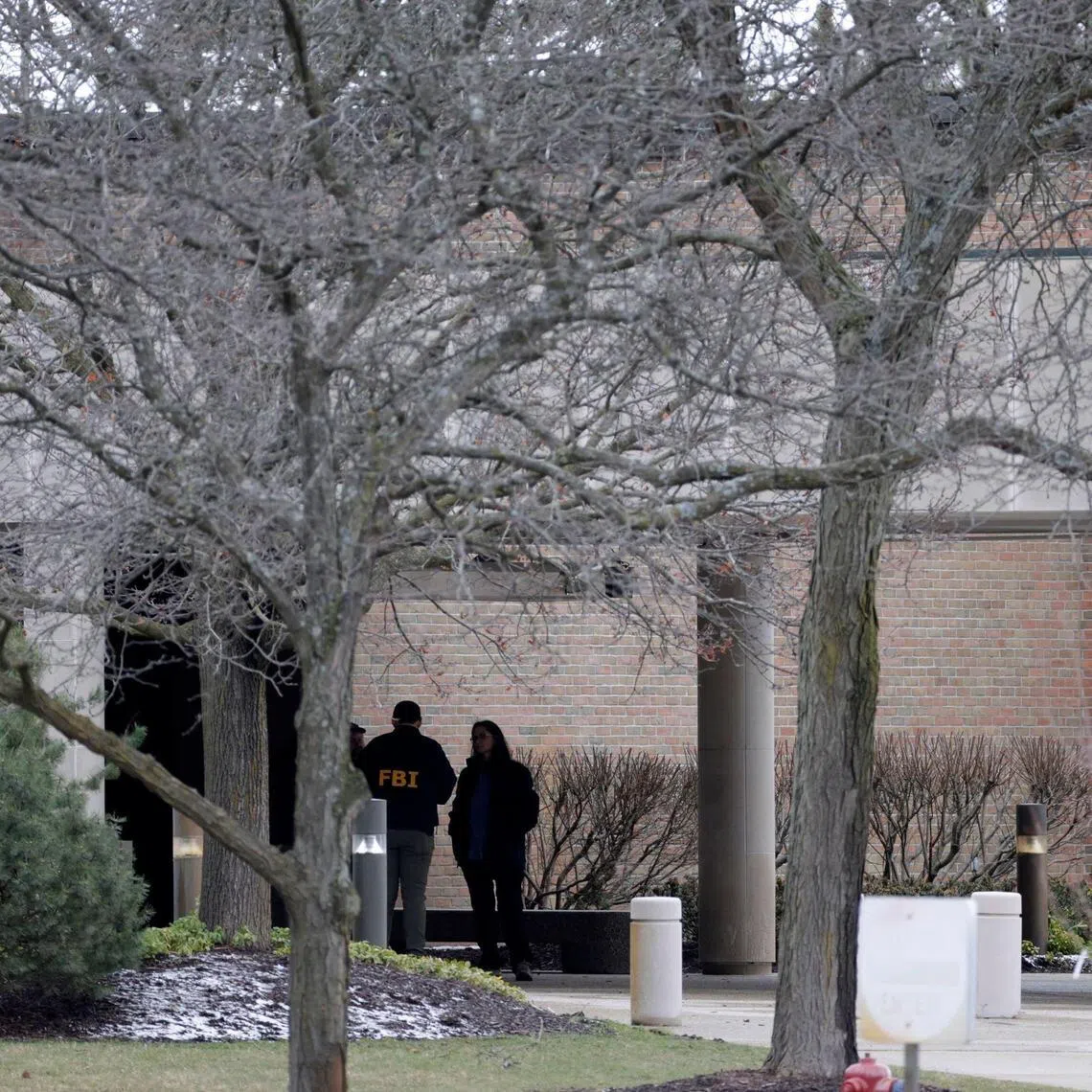 FBI agents are seen outside Temple Israel synagogue in West Bloomfield, Michigan, on March 13.
