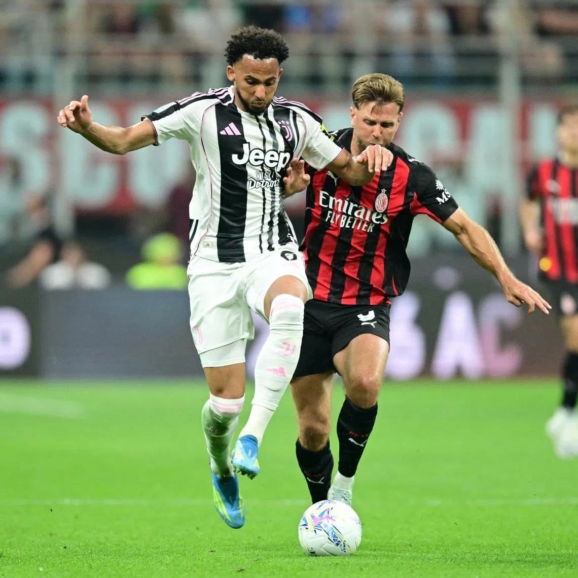 Soccer Football - Serie A - AC Milan v Juventus - San Siro, Milan, Italy - April 26, 2026 Juventus' Lloyd Kelly in action with AC Milan's Niclas Fullkrug REUTERS/Daniele Mascolo