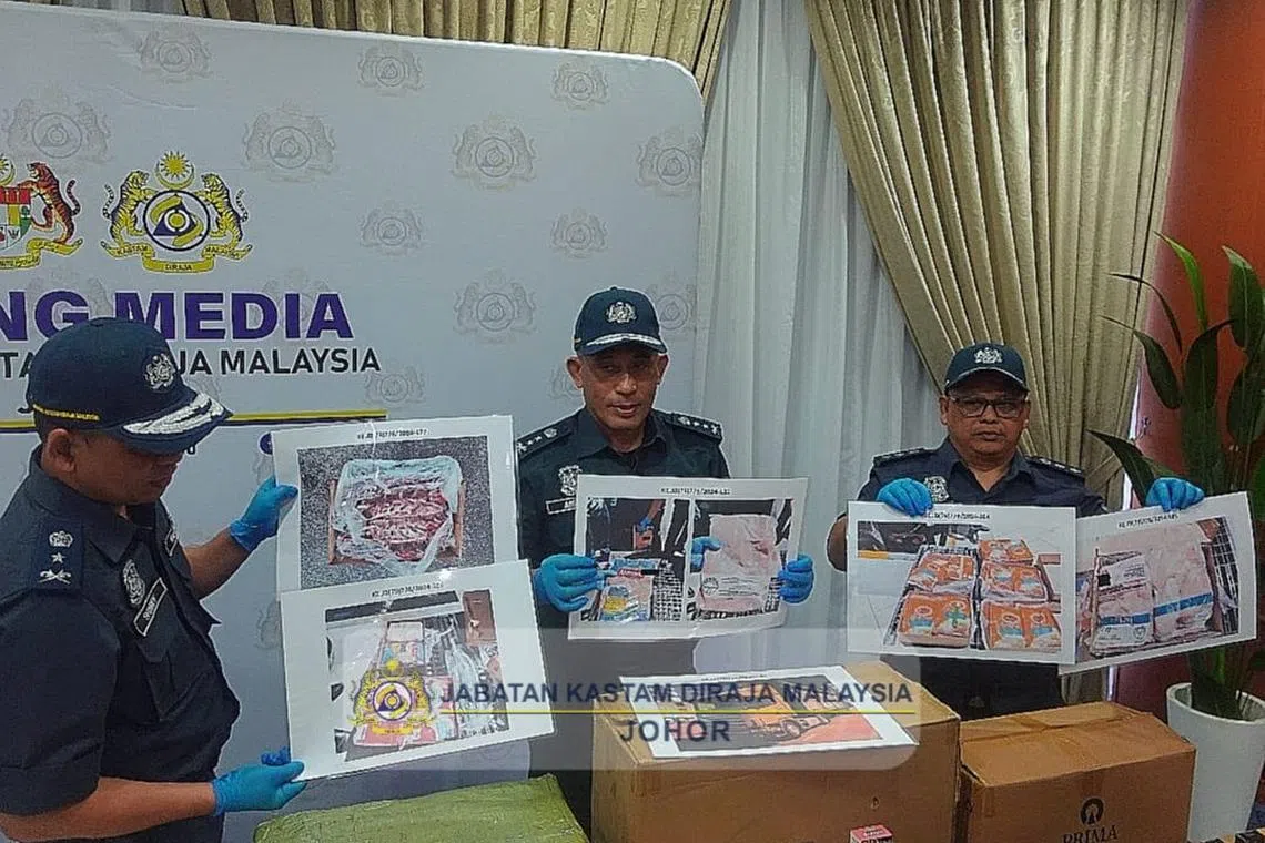 Frozen meat was confiscated from five lorries that entered the state from Singapore on May 21.