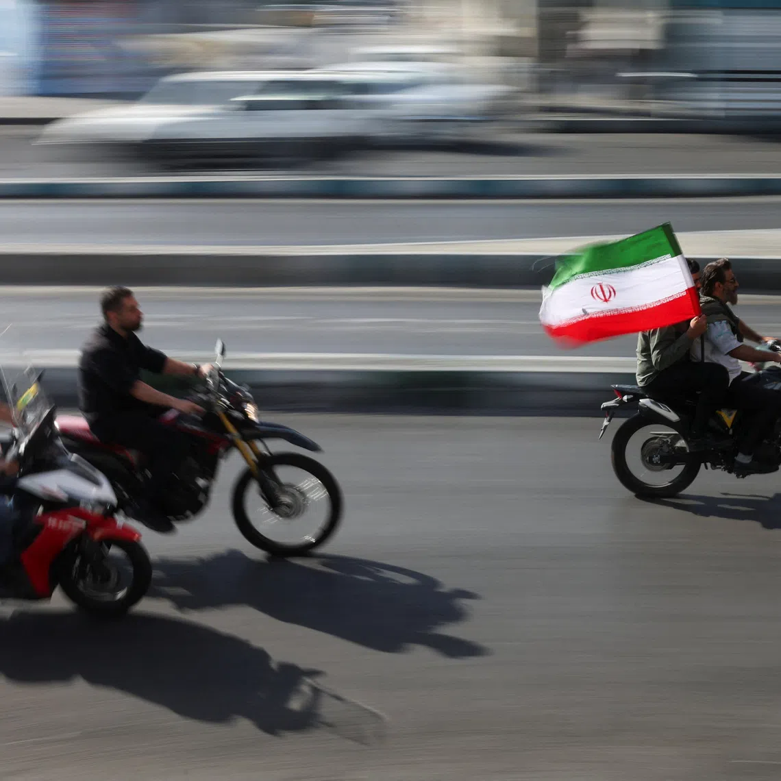 People ride on motorcycles as they participate in a march in Tehran, Iran, September 25, 2026. Majid Asgaripour/WANA (West Asia News Agency) via REUTERS