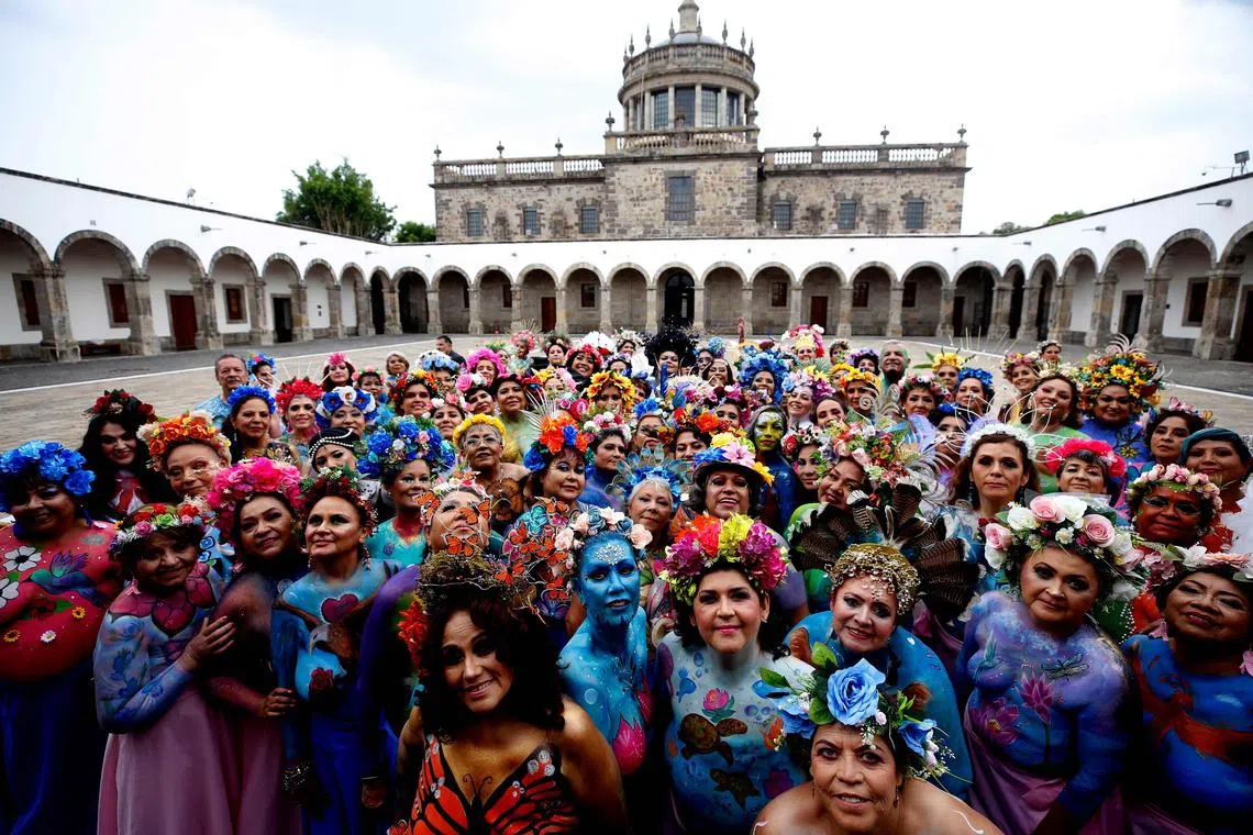Survivors of breast cancer pose for a picture for the “A Brushstroke for Life” project in Guadalajara, Mexico.