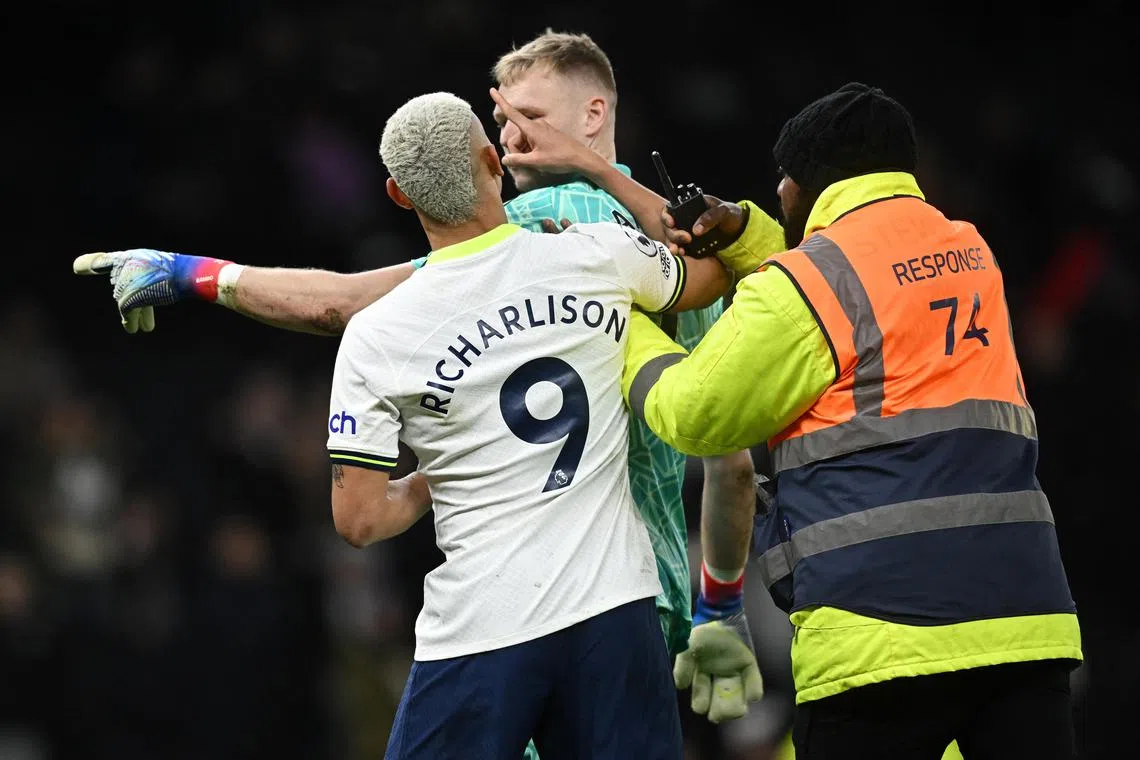 Tottenham Hotspur's Richarlison clashes with Arsenal's Aaron Ramsdale after the match.