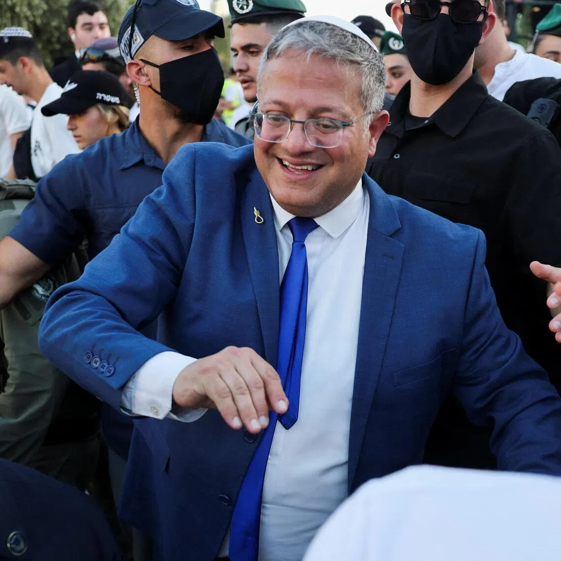 In the video shared by Mr Itamar Ben Gvir, he is seen encouraging staff at the detention centre as they push down an activist who had stood up to say “free free Palestine” as he walked by.