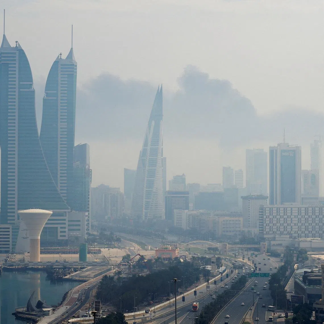Smoke rises following a reported Iranian drone strike on the fuel storage facility of Bahrain International Airport, amid the U.S.-Israeli conflict with Iran, in Muharraq, Manama, Bahrain, March 12, 2026. REUTERS/Stringer
