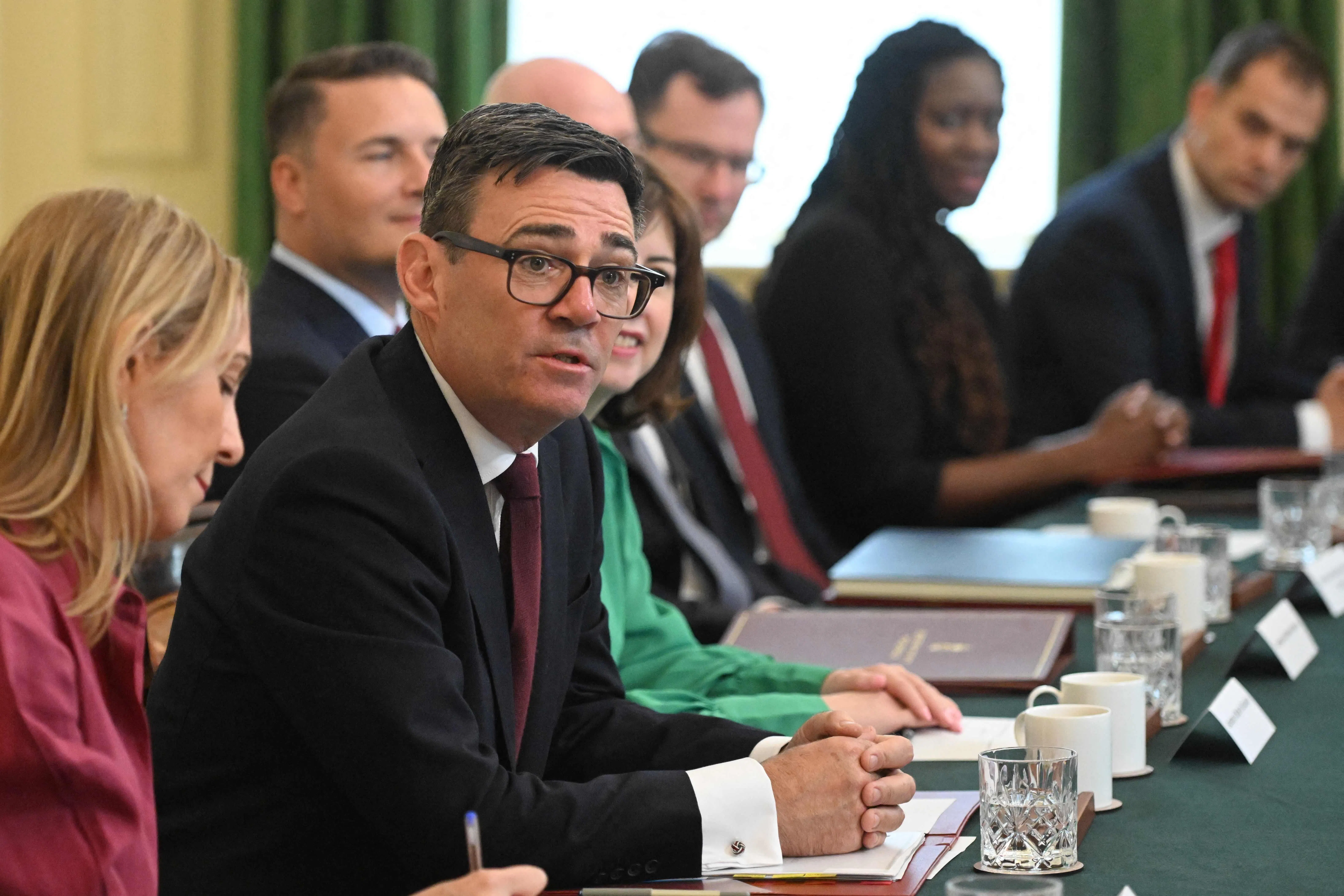 Britain's Prime Minister Andy Burnham speaks during a cabinet meeting in Downing Street in London on July 21, 2026. Britain's new Prime Minister Andy Burnham lost no time on July 20 in reshaping the cabinet he inherited from Keir Starmer, removing key figures and offering others new positions. (Photo by Eddie Mulholland / POOL / AFP)