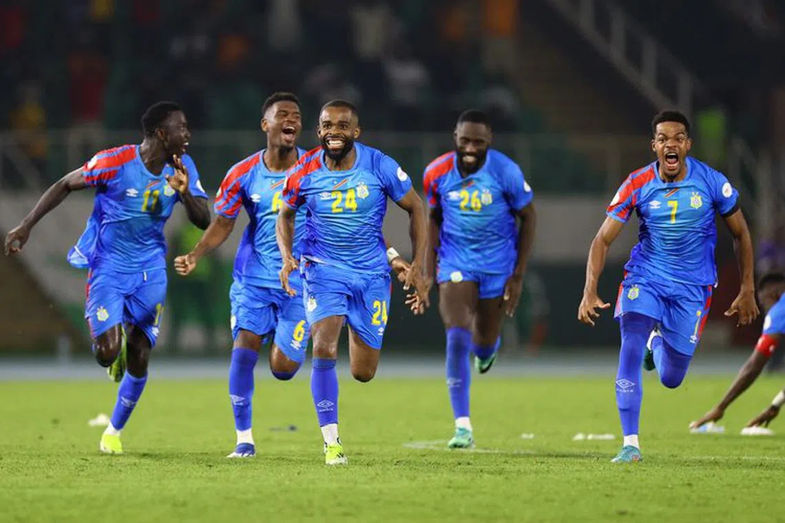 Soccer Football - Africa Cup of Nations - Round of 16 - Egypt v DR Congo - Laurent Pokou Stadium, San Pedro, Ivory Coast - January 28, 2024 DR Congo´s Gedeon Kalulu celebrate with teammates after the match REUTERS/Siphiwe Sibeko