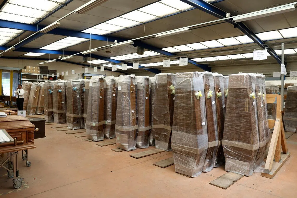 Coffins stored in a storage unit at the headquarters of Caton Funeral Directors in Orleans, on July 15.