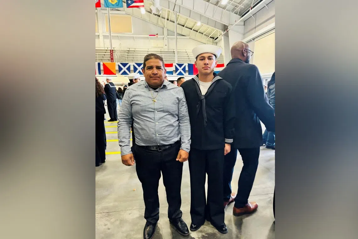 Joshua Aviles, a U.S. sailor deployed in the Middle East during the Iran war, stands next to his immigrant father, who was taken into federal immigration detention, according to what the sailor said in a Facebook post, as they pose for a picture in an unknown location, in this undated image obtained from social media. Joshua Aviles/Facebook/via REUTERS  THIS IMAGE HAS BEEN SUPPLIED BY A THIRD PARTY. MANDATORY CREDIT. NO RESALES. NO ARCHIVES. NEWS USE ONLY.